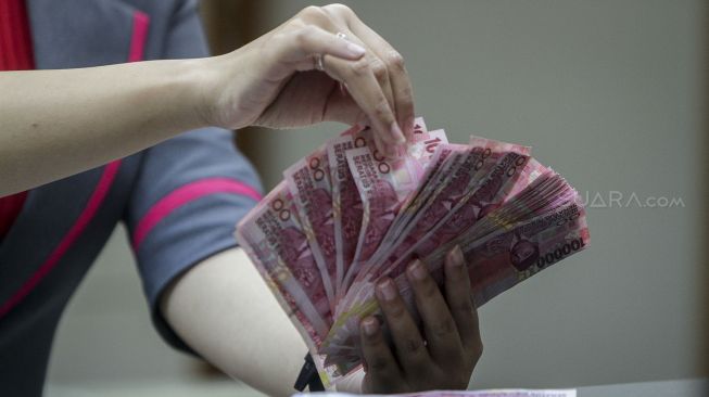 Susunan Kabinet Jokowi Bayangi Pergerakan Rupiah Awal Pekan Ini